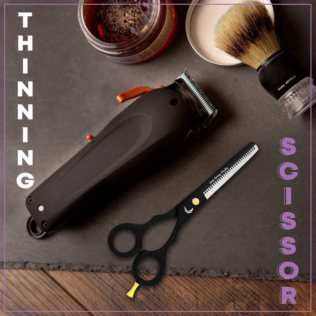 Black barber thinning scissors placed with haircut tools and accessories on table by Styleup Beauty Tools