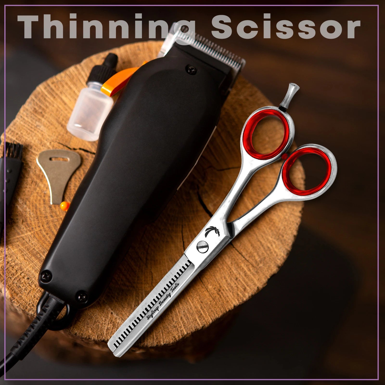 Professional stainless steel hair thinning scissors with red handles placed beside barber tools on wooden surface by Styleup Beauty Tools